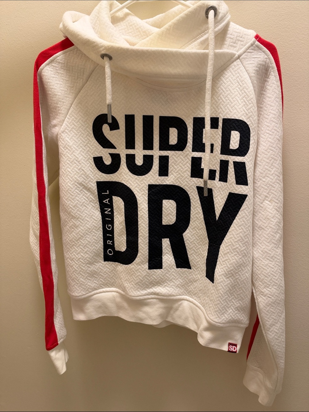 Superdry Woman’s White Sweater with Red Sleeve Stripes and Black Logo